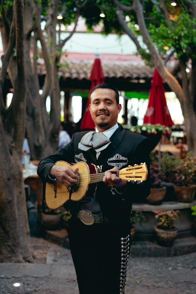 Photo by Los Muertos Crew: https://www.pexels.com/photo/man-in-black-charro-playing-guitar-7772395/