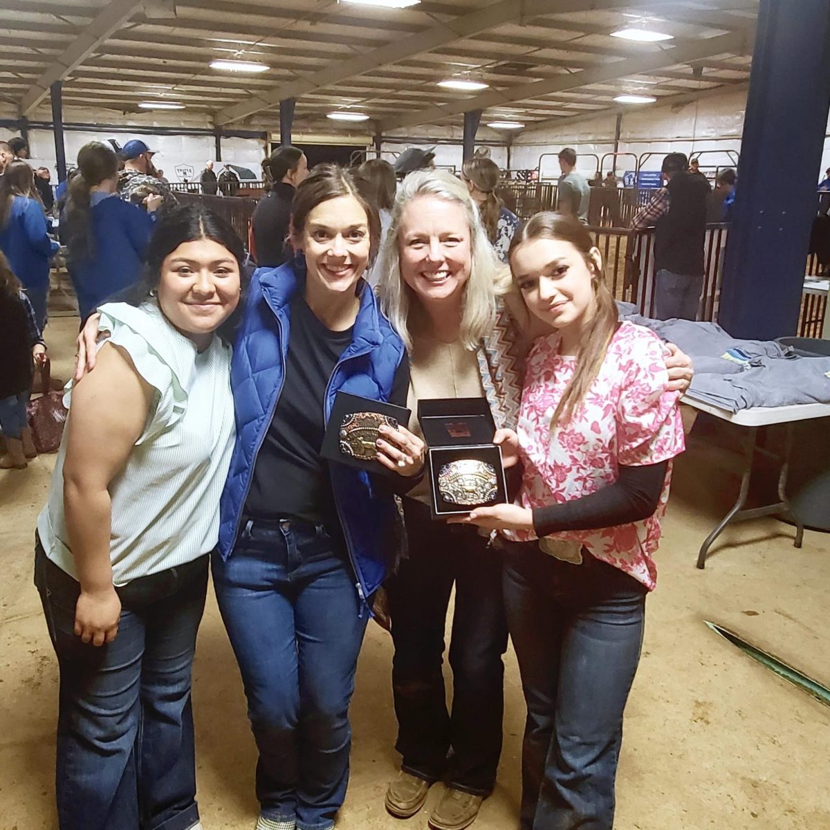 CTE director Terry Hodges and ASL teacher Amy Thompson poses with their buckles alongside their partners, junior Jenifer Torres and sophomore Faith Olds. They won their buckles at the annual FFA Chapter Show.
Photo by Amy Thompson