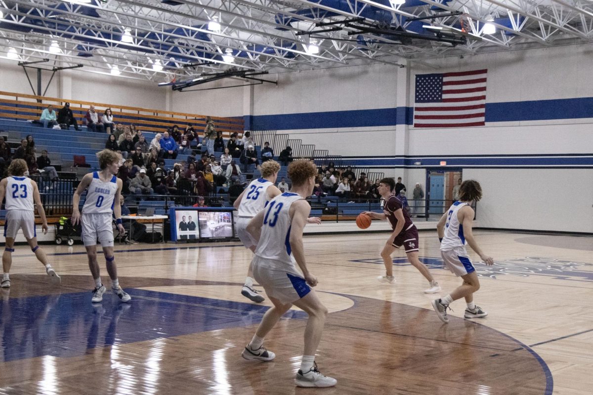 The Lindale Eagle Basketball team defends against an enemy. They regained the ball and struck back, scoring a two-pointer.