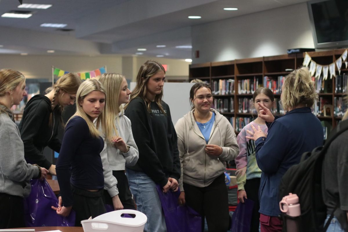 Health students listen to health care provider about opportunities available for them. Students in all health care classes were able to attend the job fair.
