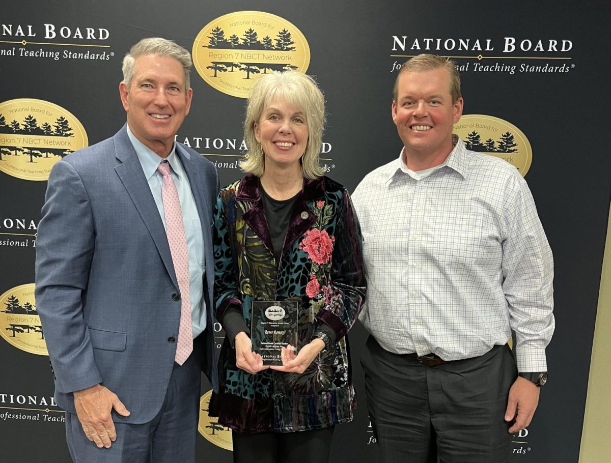 Teacher Renee Ramsey poses with her award between principal Jeremy Chilek and superintendent Stan Surratt. Photo provided by Renee Ramsey.