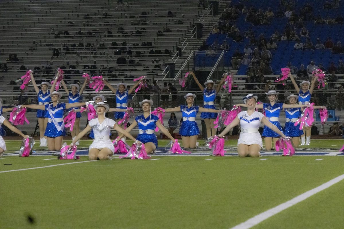 The Drill Team performs a ribbon routine during half time. The girls performed to the song Love Runs Out by One Republic. 