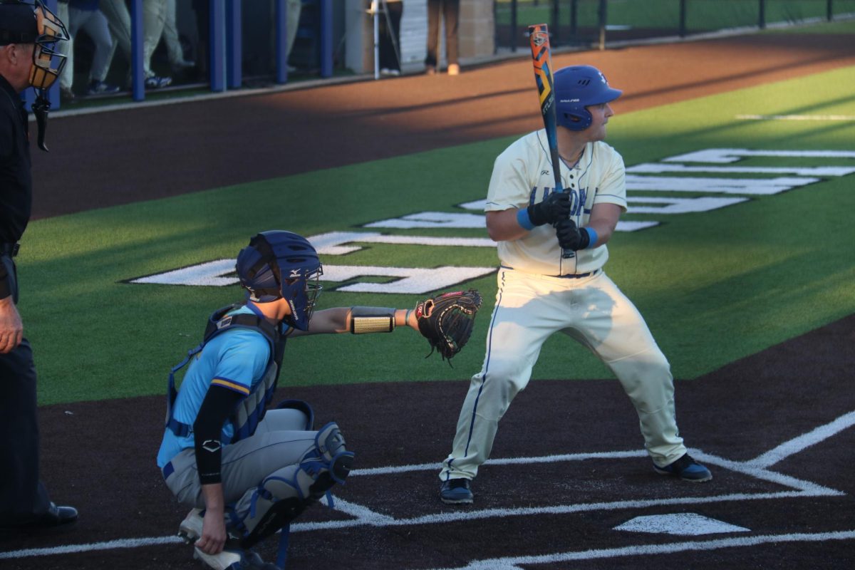 A baseball player gets ready to swing at the ball.