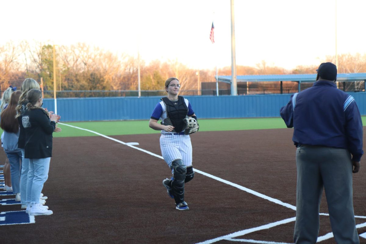 Sophomore Kirby Kleam runs to coaches at Mr Surratts first pitch.