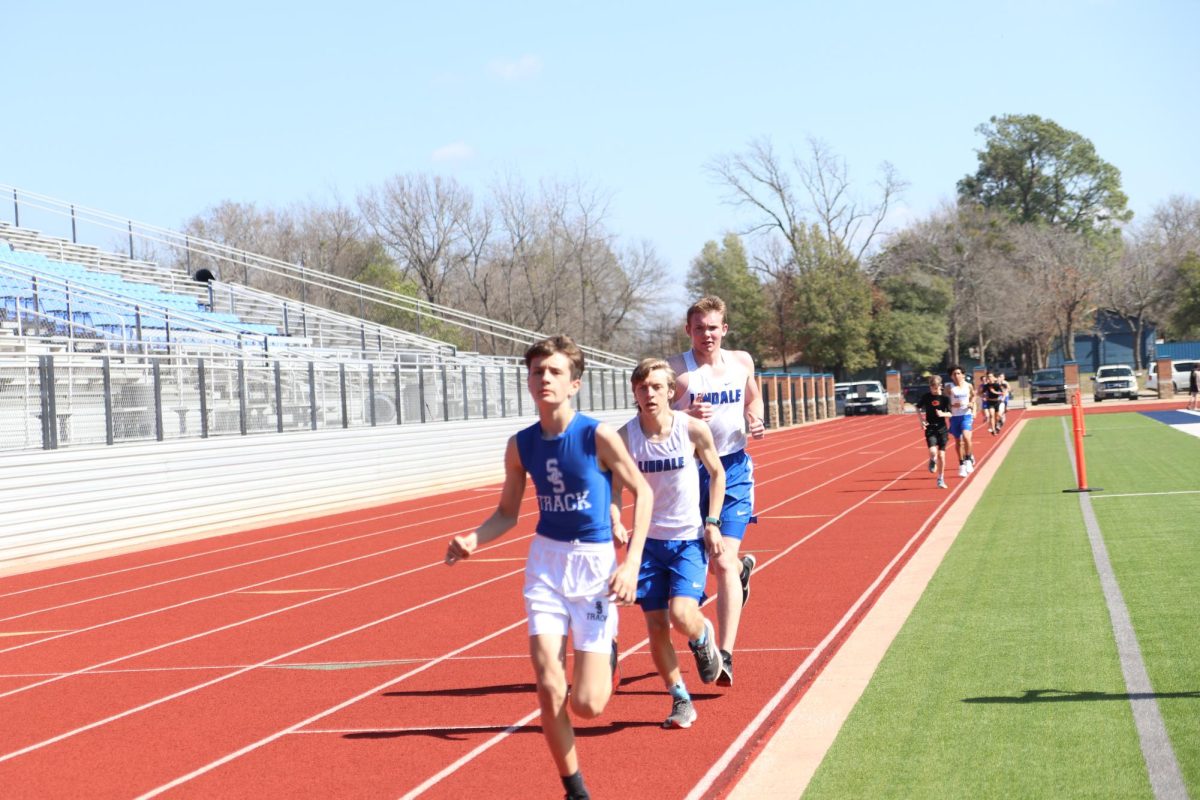 Students run the 2 mile race at a track meet. This is the longest race at the track meet. 