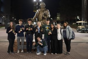 Debate team poses for photo with awards after the tournament. There were two finalist, junior Hailey Maccalous who placed 3rd in informative speaking, and sophomore Conner Stevens who placed 9th in Congressional debate, and 3 semifinalists, juniors Madison Barnes, Odin Burks, and senior Flor Mendez.